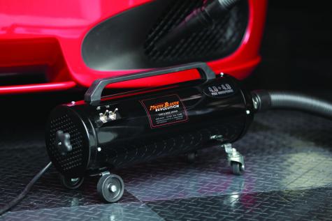 MetroVac Master Blaster Revolution dryer positioned next to a red sports car, ideal for automotive and motorcycle detailing.