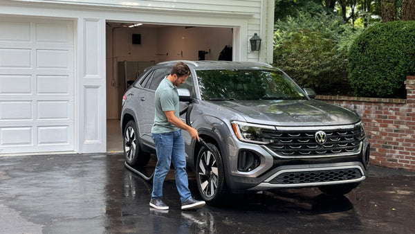 User drying the wheels of a gray SUV with the Master Blaster Car Dryer, highlighting it as a powerful air blower for car surfaces.