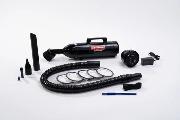 Full MetroVac Cordless DataVac CDV-1-A vacuum kit displayed with all included accessories, attachments, filters, power cord, and hose on a white background.